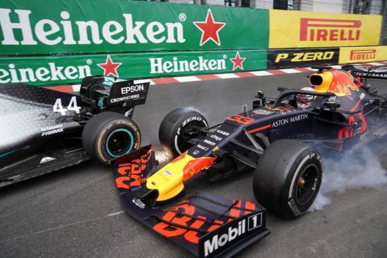 Max Verstappen and Lewis Hamilton touch wheels during the 2019 Monaco Grand Prix.